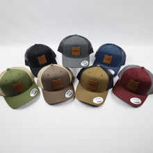 Load image into Gallery viewer, Trucker Hat with Leather Rockface and Pictograph Patch