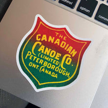 Load image into Gallery viewer, Canadian Canoe Company Sticker on a Laptop

